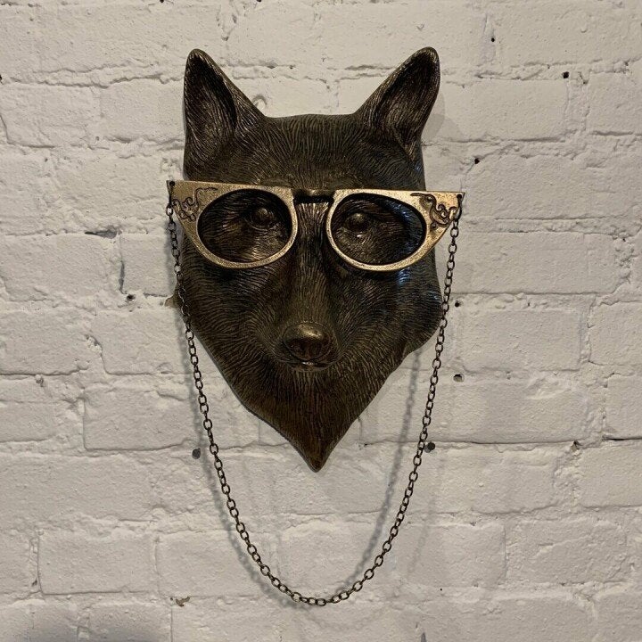 Handcrafted bear resin wall decor, distinctive wildlife sculpture adds charm.