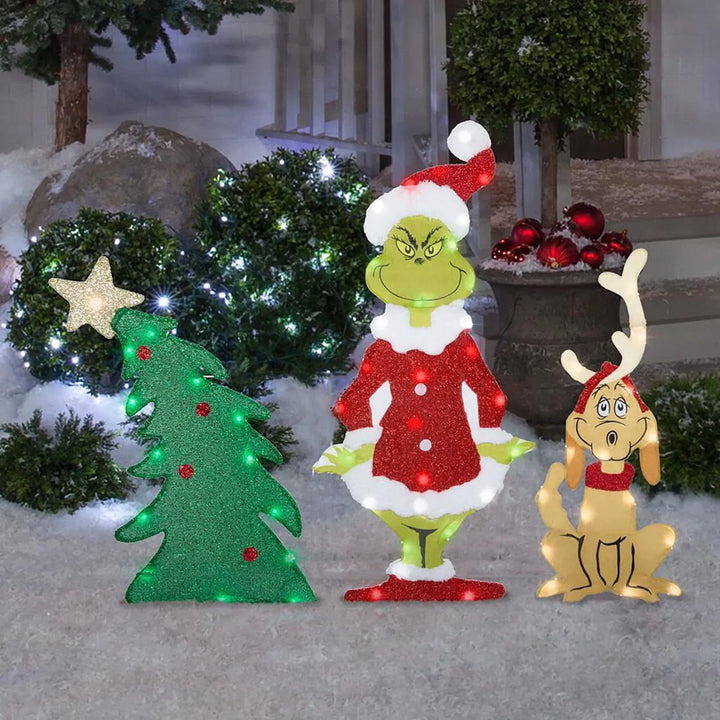 Whimsical Grinch holiday character garden light. Cheerful green outdoor LED Christmas decoration.
