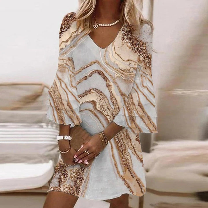 Chic A-line mini dress for women, featuring a V-neck, flared sleeves, and a vibrant geometric print, perfect for summer.