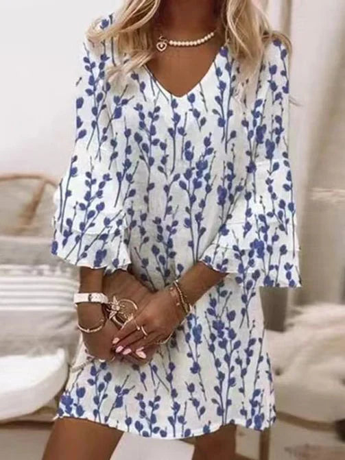 Women's short V-neck A-line dress, featuring elegant flare sleeves and a modern geometric print for casual style.