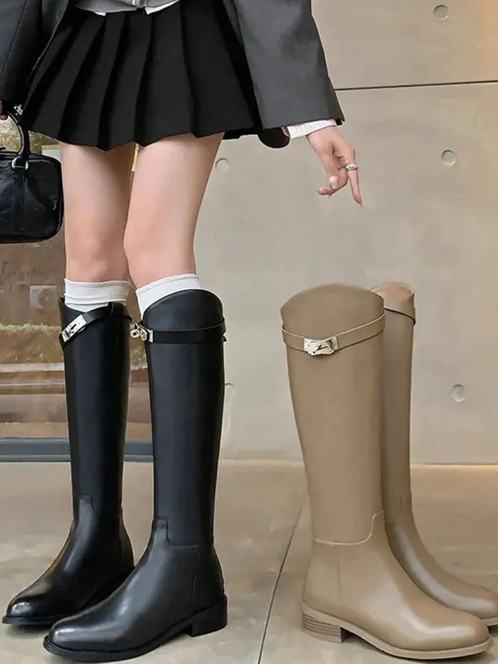 Statement women's knee-high boots in black, designed for fashion-forward fall & winter style.