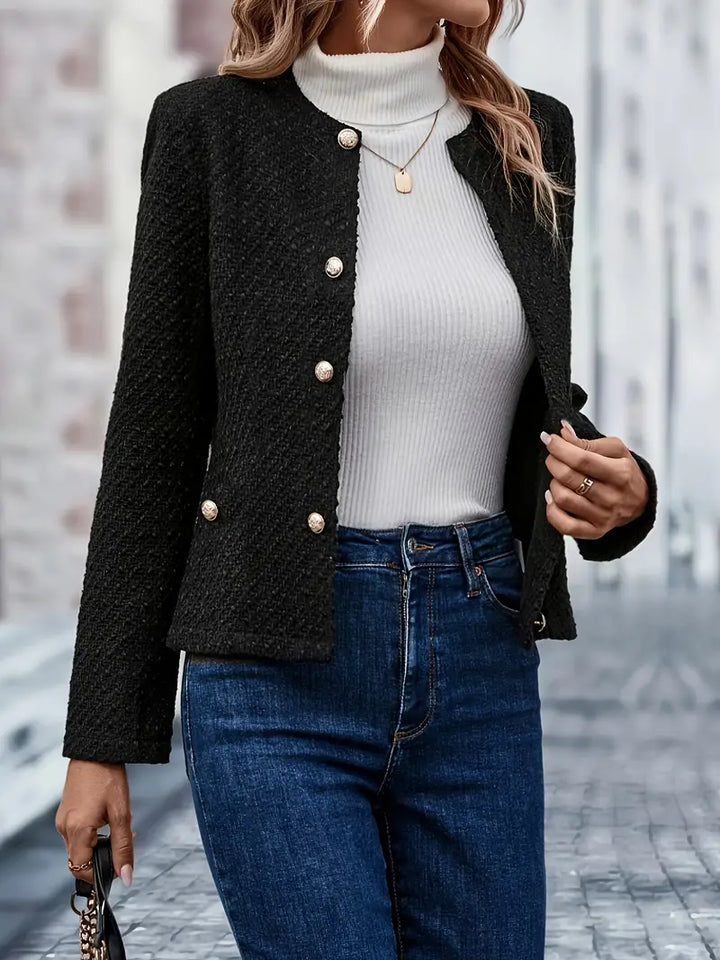 Simple yet elegant women's black jacket, perfect for casual or professional outfits.
