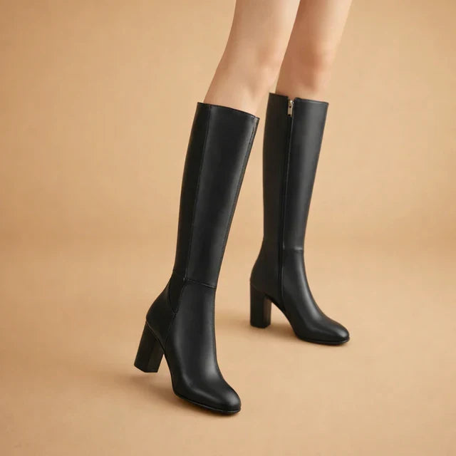 Women's stylish over-the-knee high heel boots in black. Chic, elegant winter footwear for fashion-forward dress boots.