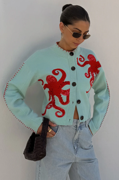 Nautical octopus knit cardigan in a soothing blue hue, a stylish addition to any wardrobe.