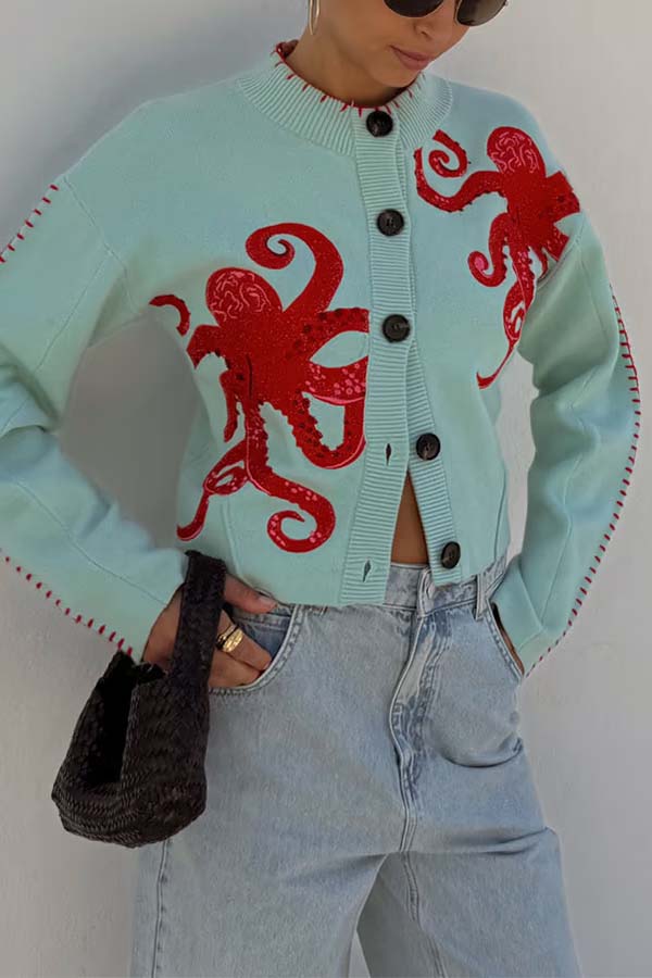 Blue relaxed fit cardigan, perfect for casual wear, featuring a distinctive nautical octopus.
