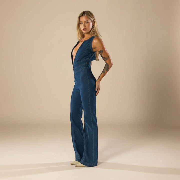 Gorgeous blue women's deep V-neck evening jumpsuit with flared legs, a chic and flattering fitted style.
