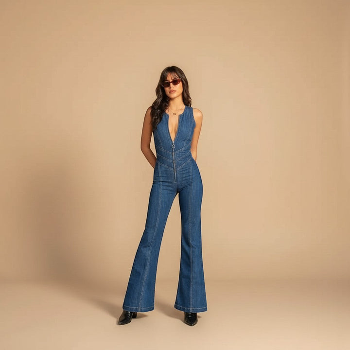 Fashionable women's blue deep V-neck flared leg jumpsuit, a sophisticated one-piece for special occasions.