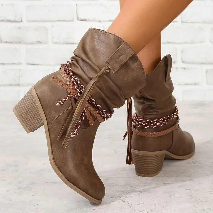 Women's fashion ankle boots, brown leather, with stylish western design & eye-catching tassel detail.