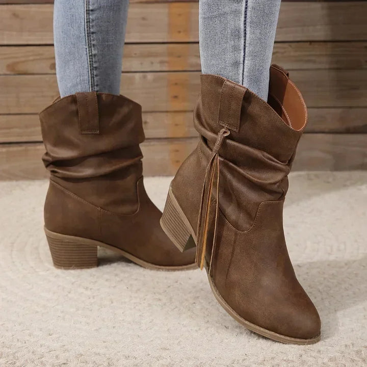 Versatile women's brown western ankle boots with chic tassel accents, ideal for stylish fall outfits.