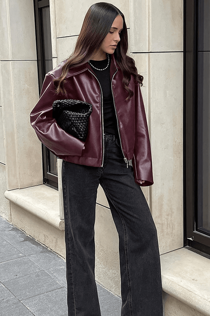 Back of a women's burgundy cropped jacket, a stylish red outerwear piece for any lady.