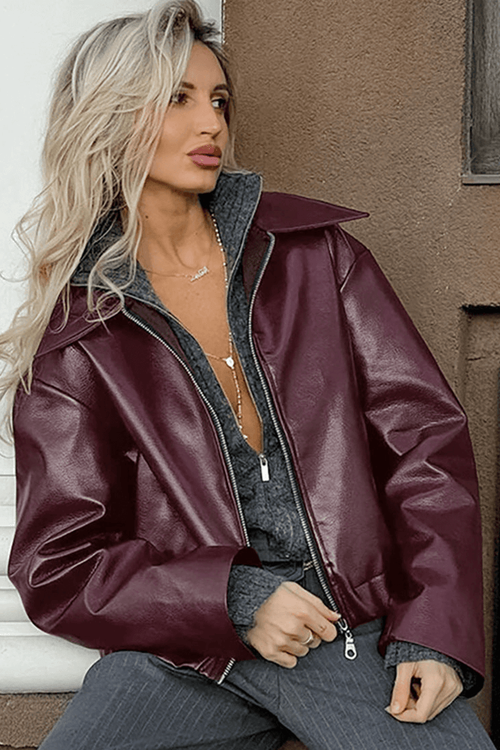 Front view of a versatile women's cropped red jacket, modern ladies' apparel for a chic look.