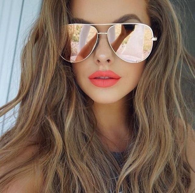 Fashionable pink mirrored aviator sunglasses for women, chic eyewear.