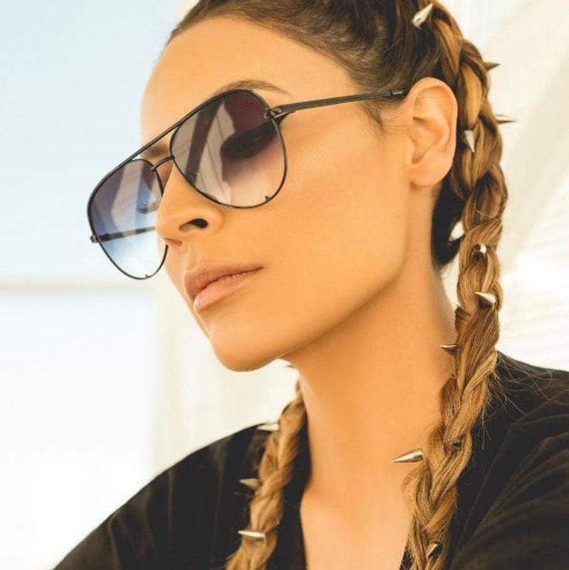 Stylish women's aviator sunglasses in gold with pink mirrored lenses.