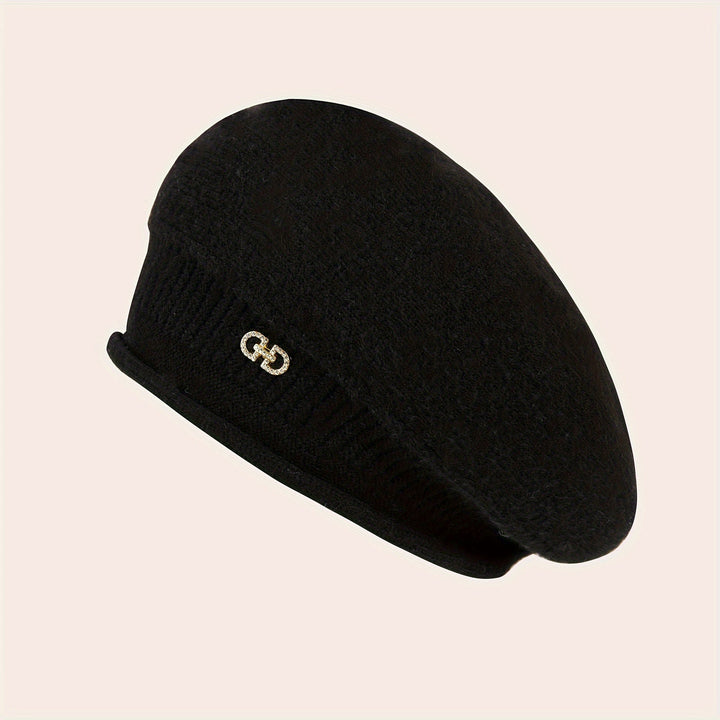 Fashionable ladies' knitted beret, offering comfort and elegance for winter outfits.