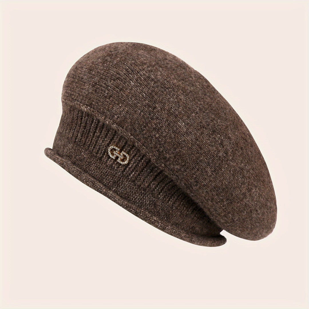 Close-up of a women's knitted beret, highlighting its soft texture and elegant design.