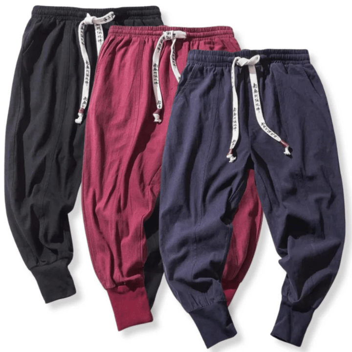 Modern black tapered pants offering a relaxed Japanese fit.