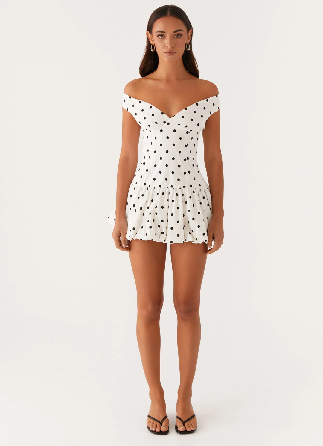 Women's fashion: adorable polka dot peplum mini dress, ideal for casual or party wear.