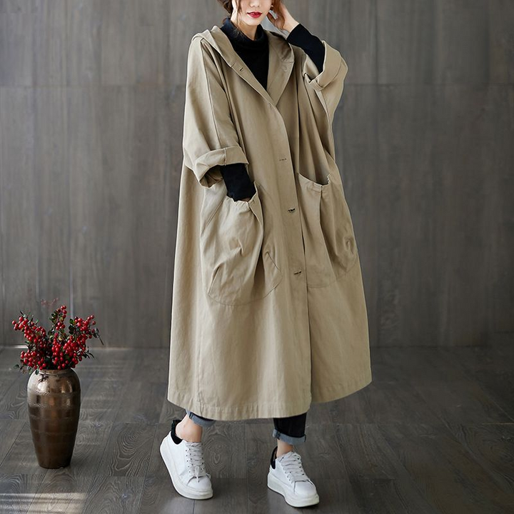 Women's stylish oversized rain jacket, a lightweight waterproof windbreaker for spring showers.