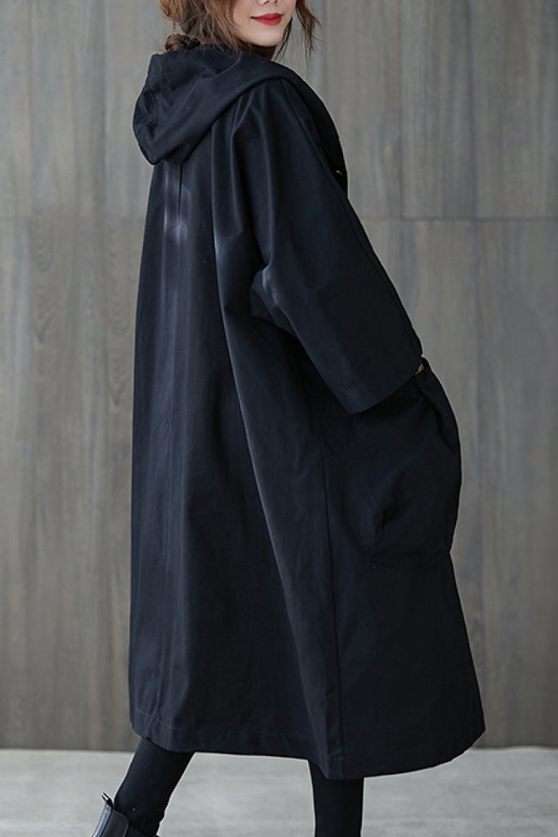Back view of a chic oversized waterproof windbreaker jacket for women, lightweight & stylish.