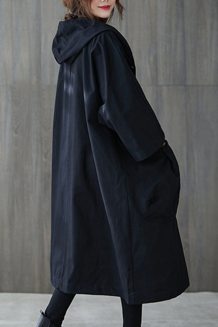 Back view of a chic oversized waterproof windbreaker jacket for women, lightweight & stylish.