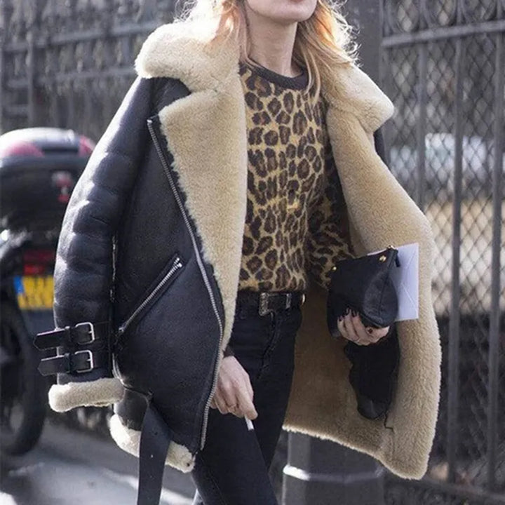 Model wearing the Chic & Stil women's belted suede outerwear, a fashionable and warm jacket.