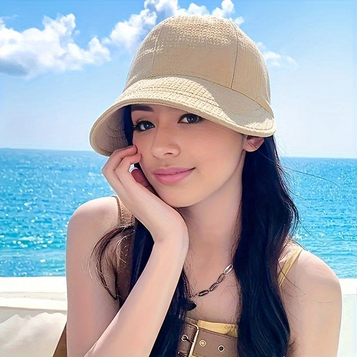 Stylish women's sun hat featuring UPF protection and a secure drawstring closure