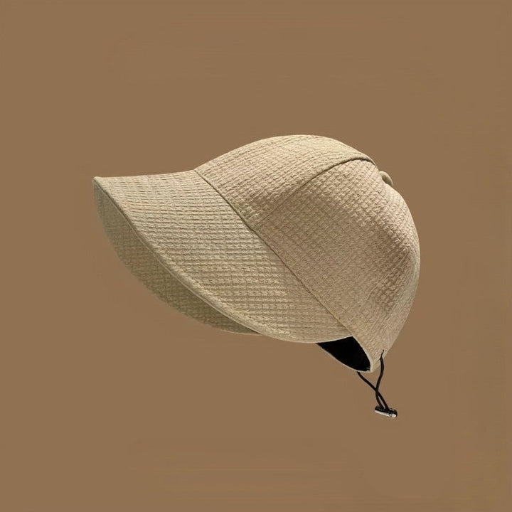 Travel-ready women's hat by Chic Und Stil with UPF sun protection and drawstring