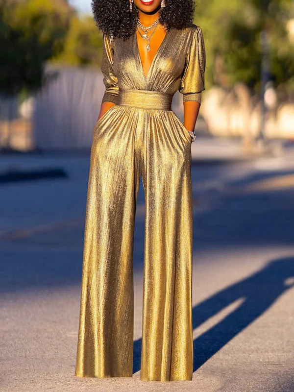 Enhance your evening look with this sophisticated green and gold shiny jumpsuit.