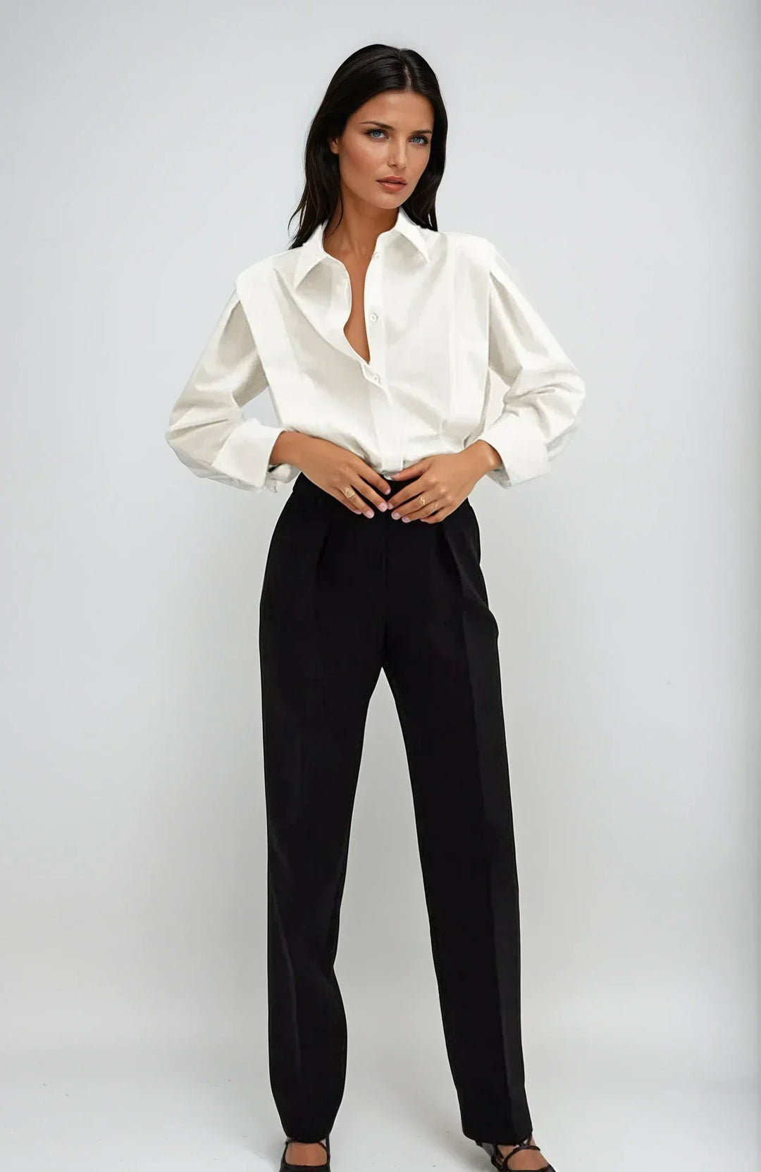 Chic white boxy button-down blouse for women, perfect for modern casual or office wear.