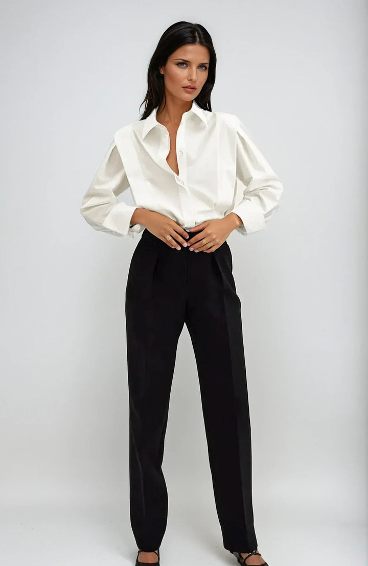 Chic white boxy button-down blouse for women, perfect for modern casual or office wear.