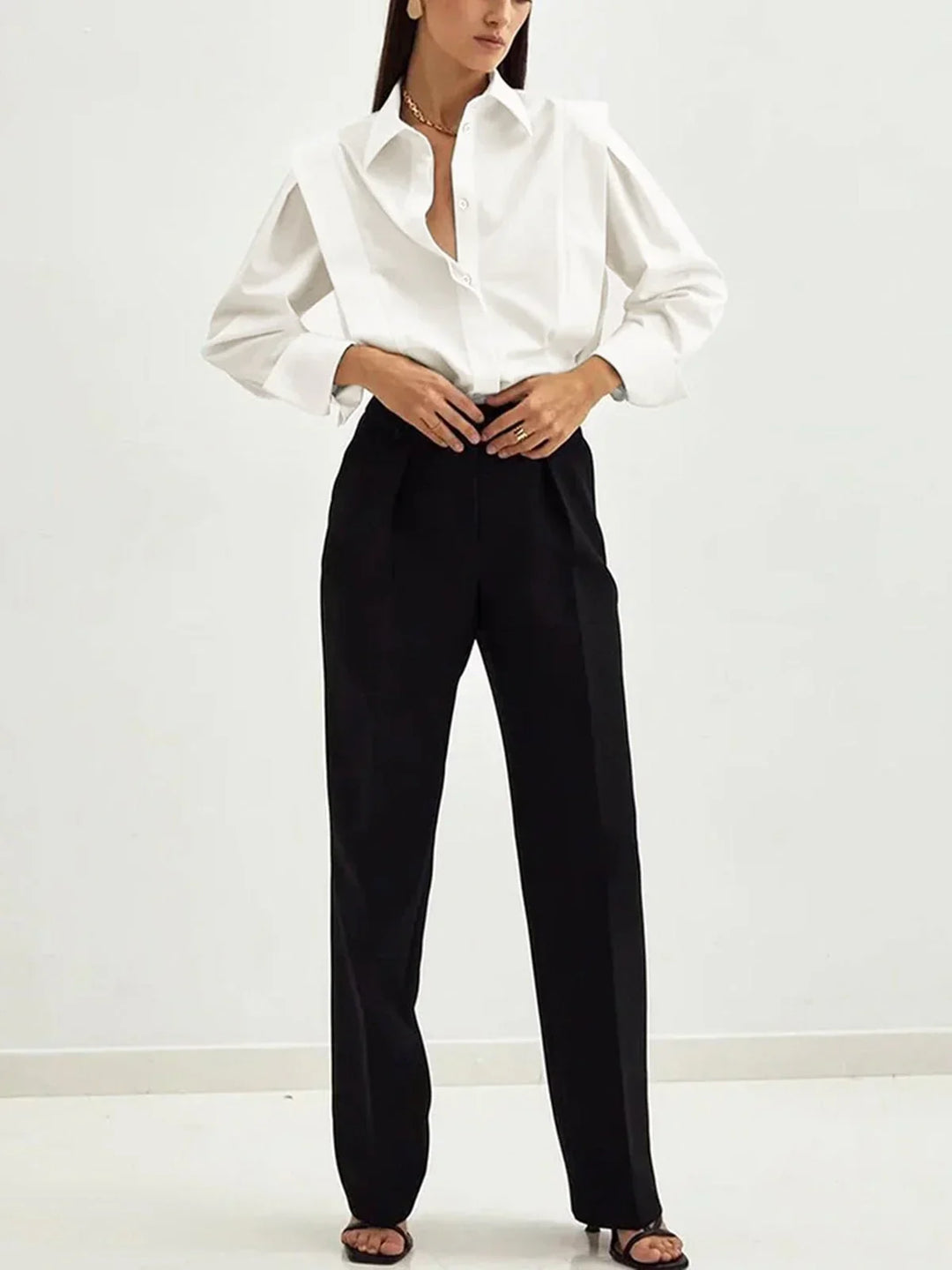 Elegant black boxy button-down blouse for women, a versatile top perfect for office or casual chic.