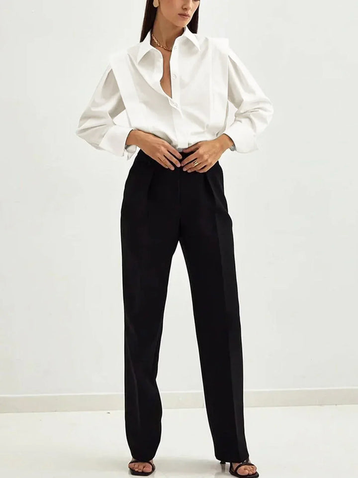 Elegant black boxy button-down blouse for women, a versatile top perfect for office or casual chic.