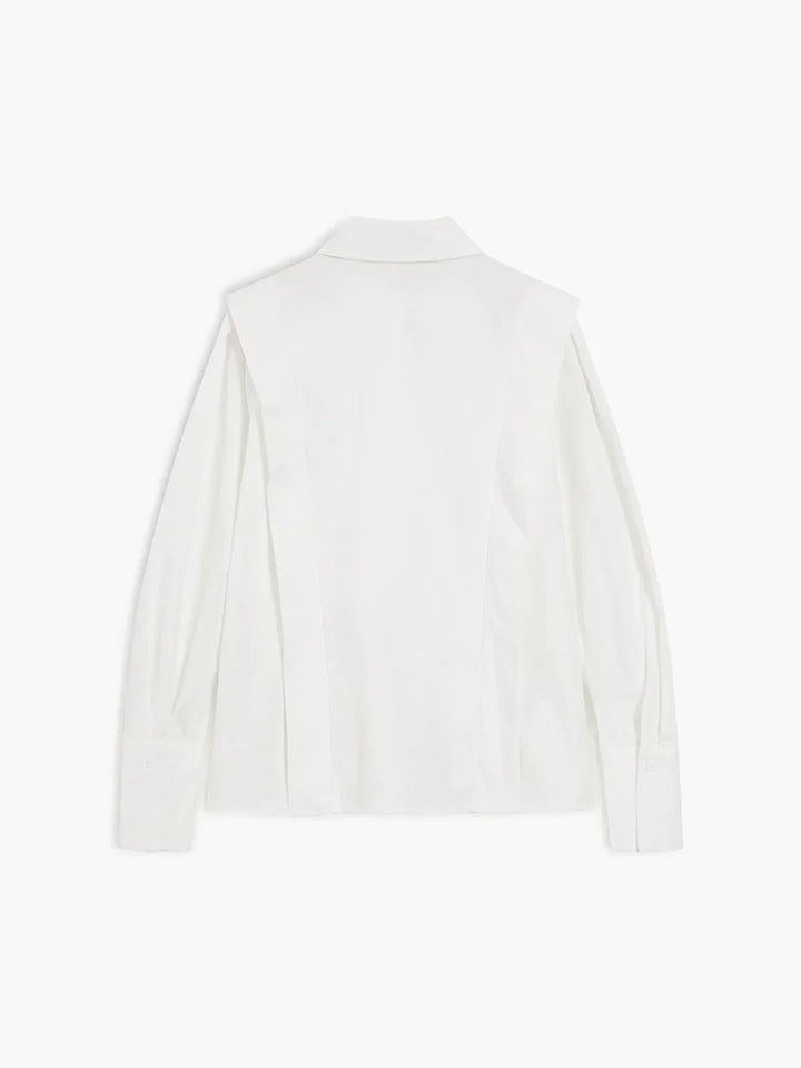Stylish women's button-down blouse in a modern boxy silhouette, suitable for various occasions.