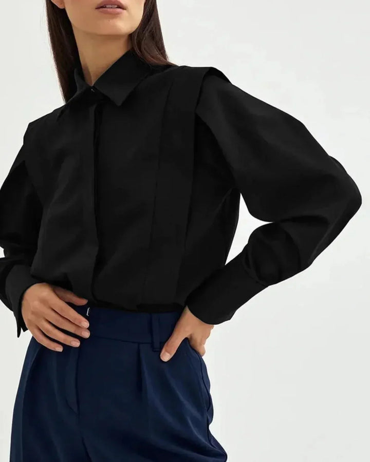 Modern women's white boxy button-down shirt, a versatile blouse for chic office wear or casual outings.