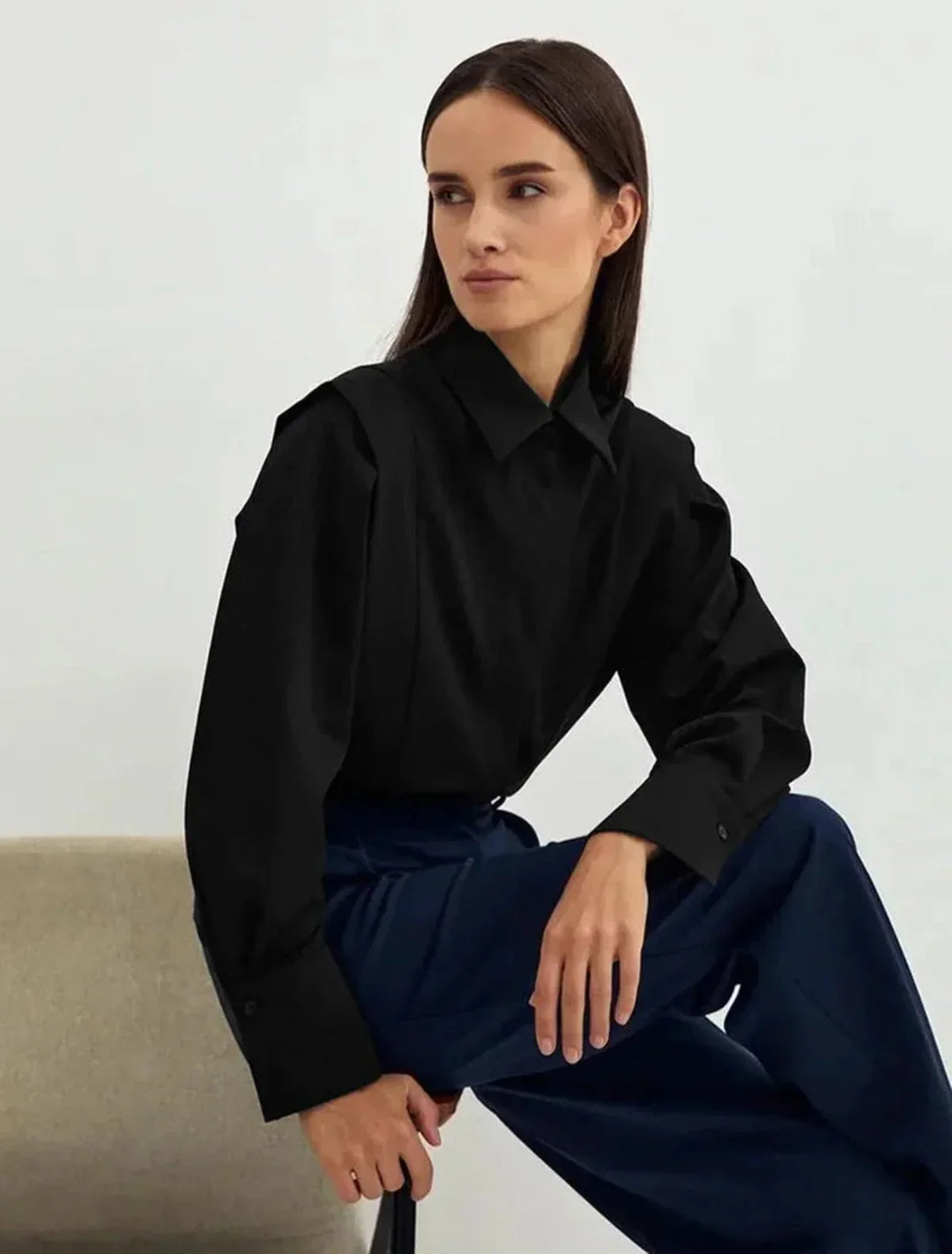 Comfortable black women's boxy button-down blouse, an elegant and versatile top for any wardrobe.