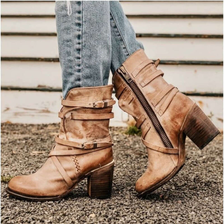 Chic women's ankle boots with multiple buckle straps and a comfortable block heel, perfect for fall fashion.