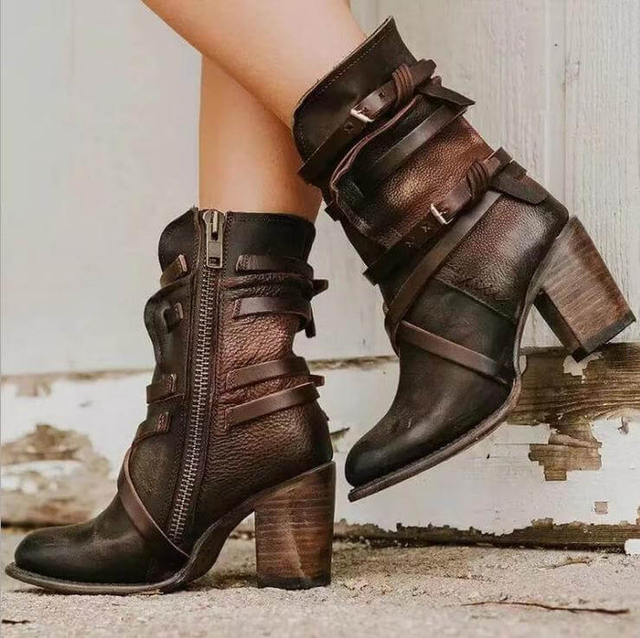 Stylish women's ankle boots with decorative buckle straps & a sturdy block heel, ideal for fall & winter fashion.
