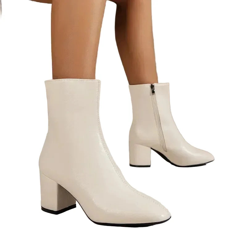 Comfortable women's ankle boots featuring a stable block heel for everyday elegance and stylish support.