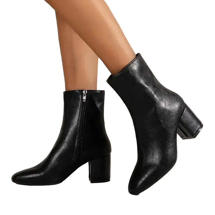 Stylish women's ankle boots with a chic finish and stable block heel for winter fashion.