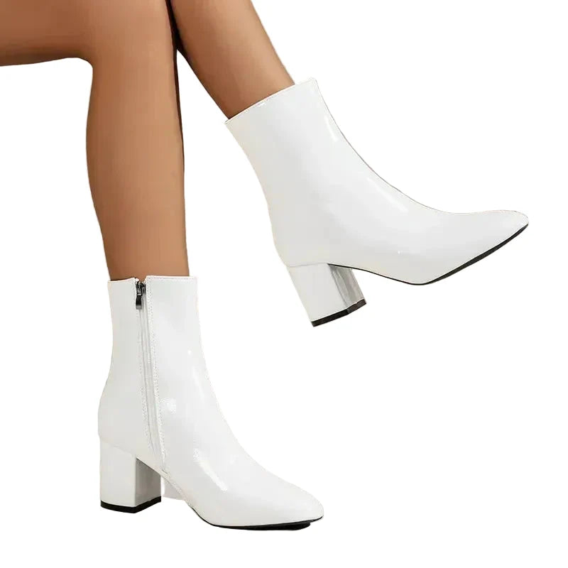 Versatile women's ankle boots with a stable block heel, perfect for pairing with fall and winter outfits.