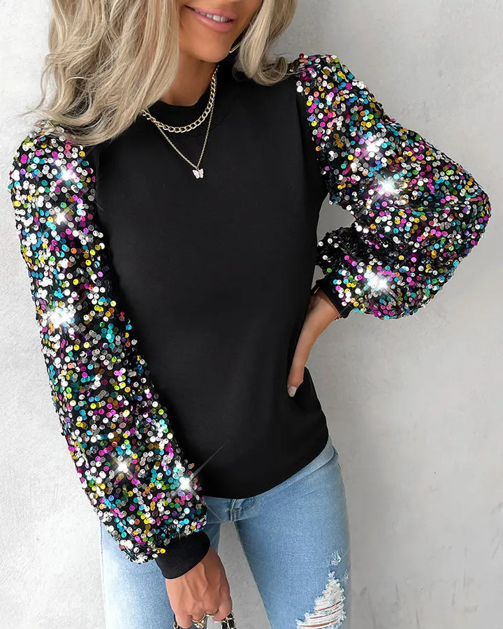 Chic women's top: sophisticated balloon sleeves, shimmering sequin details, and a modern contrast panel design.