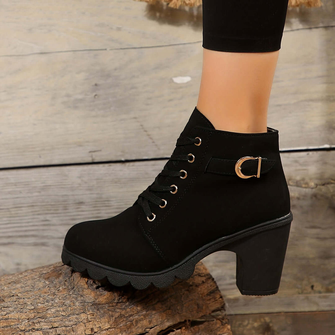 Elegant women's ankle boots with sturdy block heel & fashionable buckle detail. Perfect women's footwear.