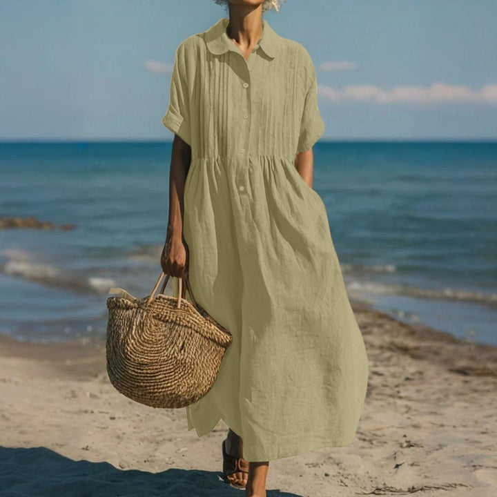 Versatile women's summer midi dress, collared & buttoned, offering relaxed, chic everyday style.