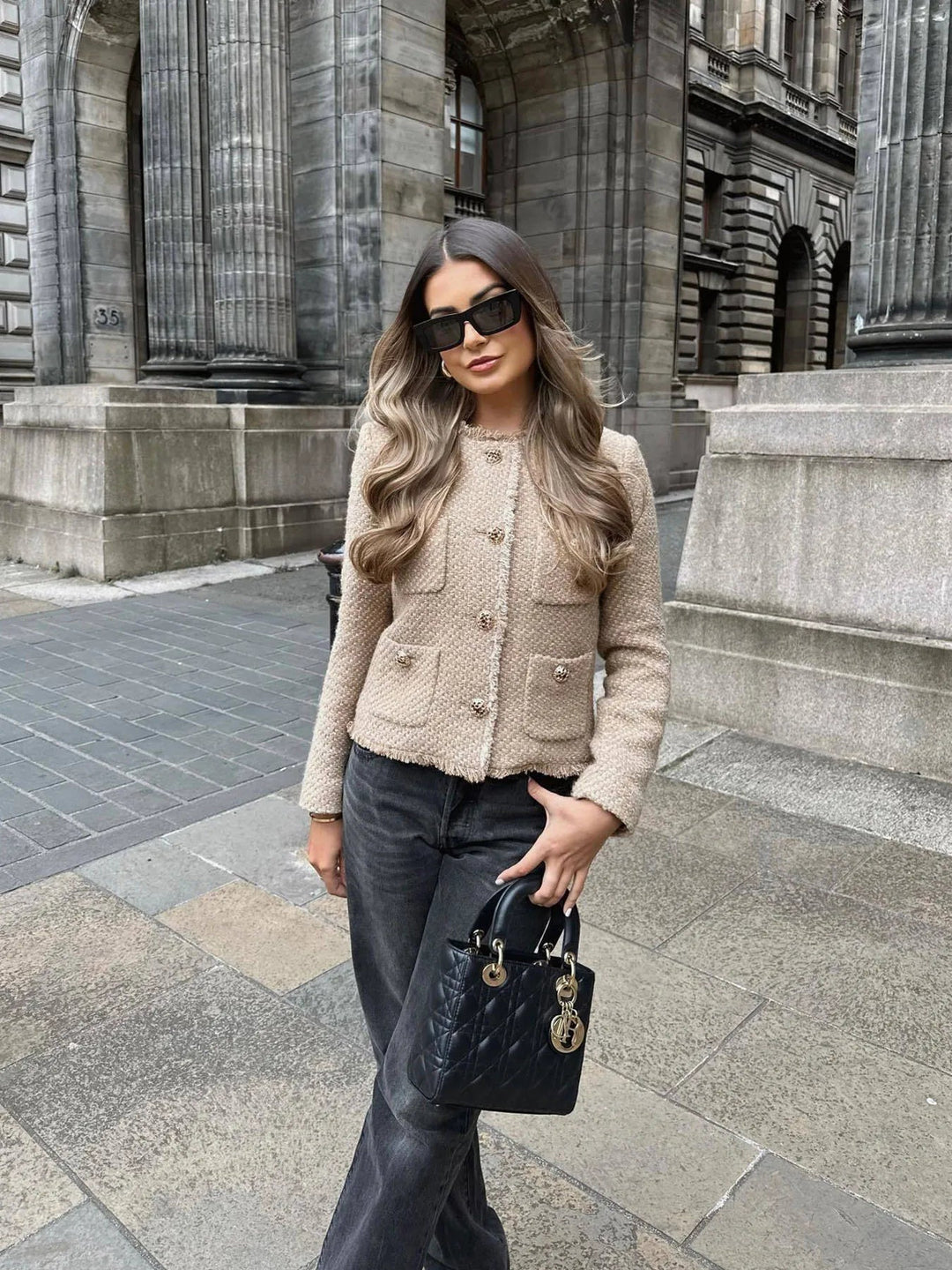 Structured women's chic cropped blazer jacket with buttons, offering a sophisticated & modern elegant fashion look.