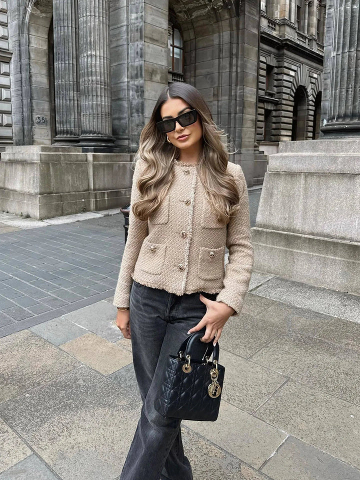 Structured women's chic cropped blazer jacket with buttons, offering a sophisticated & modern elegant fashion look.