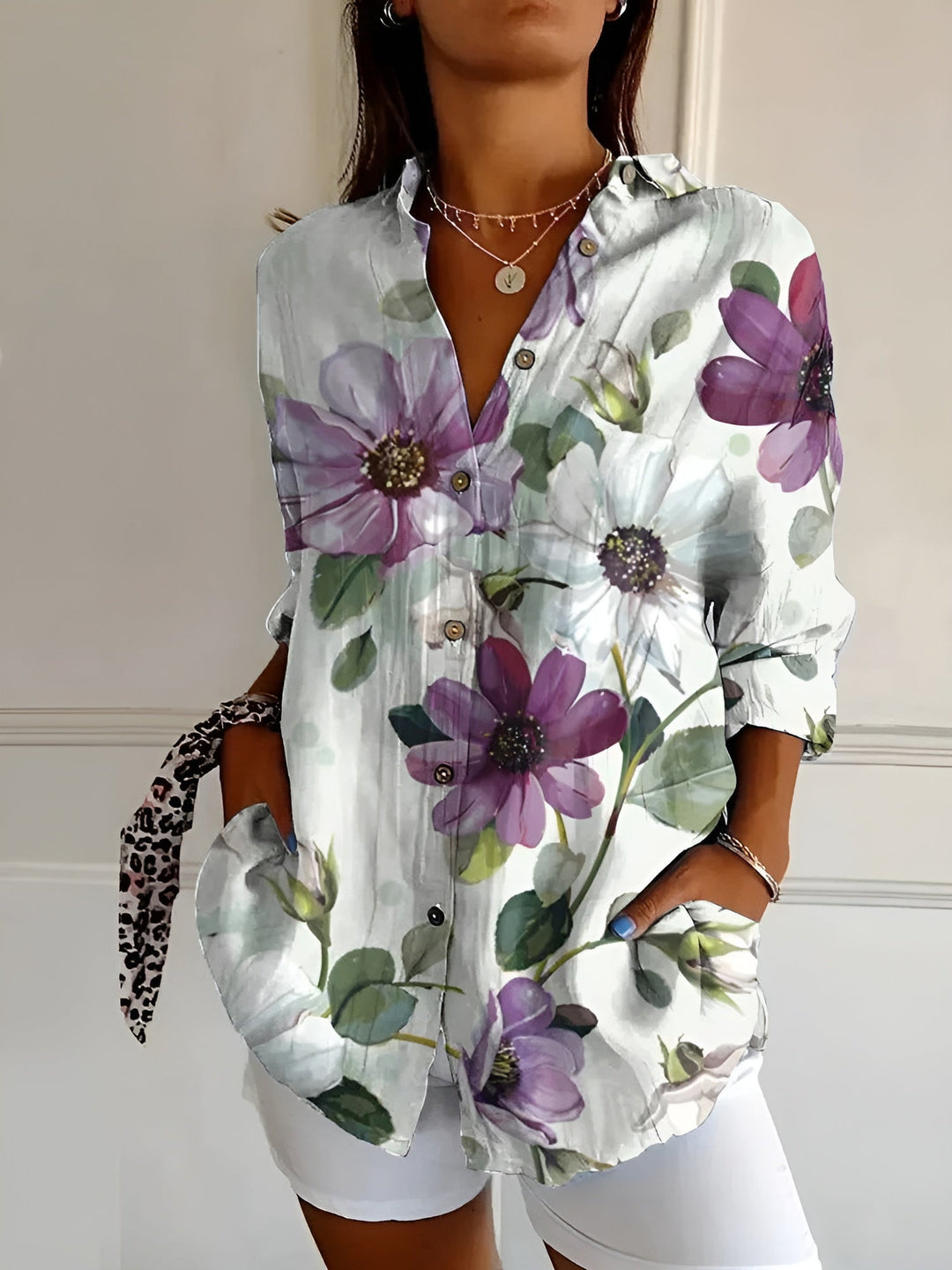 Versatile women's floral button-front blouse, perfect for summer, offering a chic, loose-fit, and comfortable style.