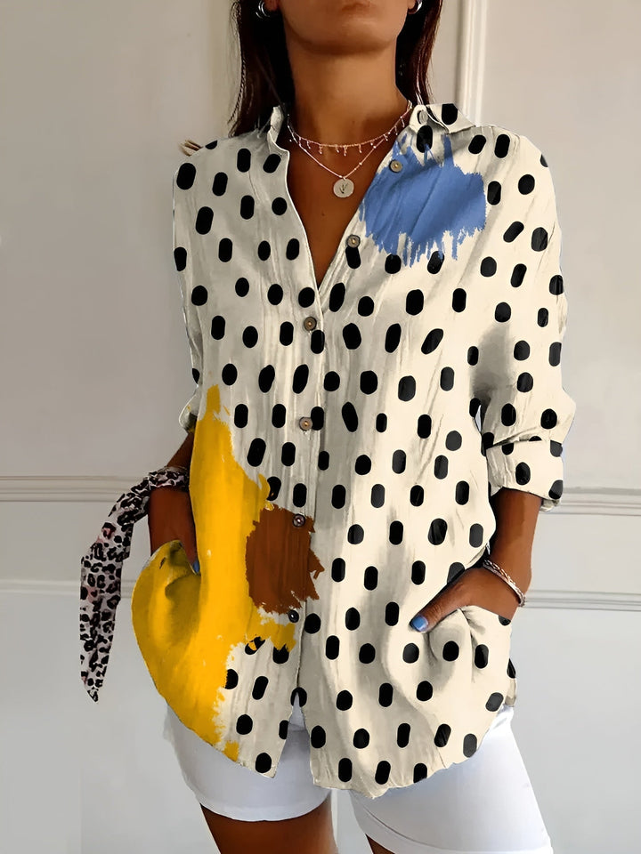 Bright floral print women's summer blouse with button front, a breezy and comfortable top for sunny days.
