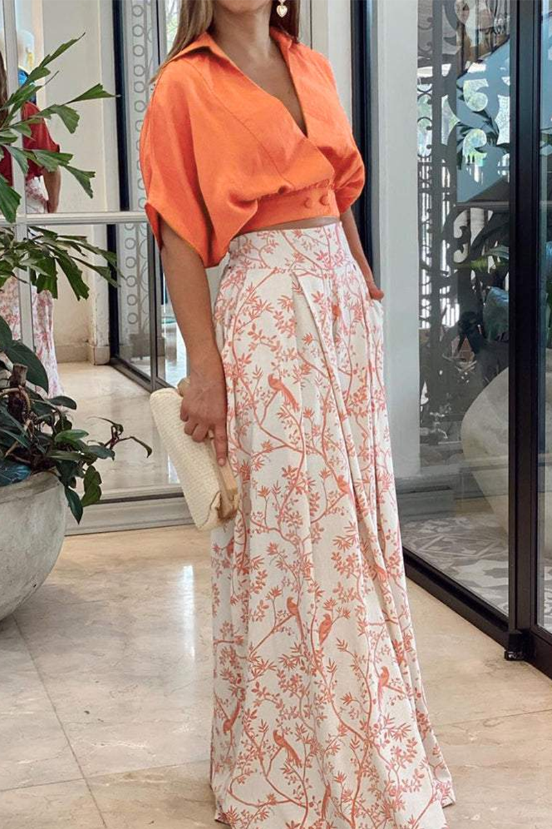 Stylish women's floral co-ord set with a crop top & flowy wide-leg pants, ideal for vacation or casual wear.