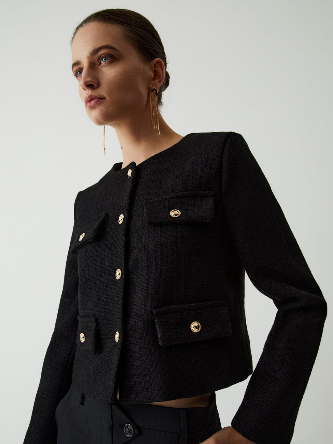 Modern women's cropped blazer with stylish gold buttons. Versatile long sleeve jacket for day to night.