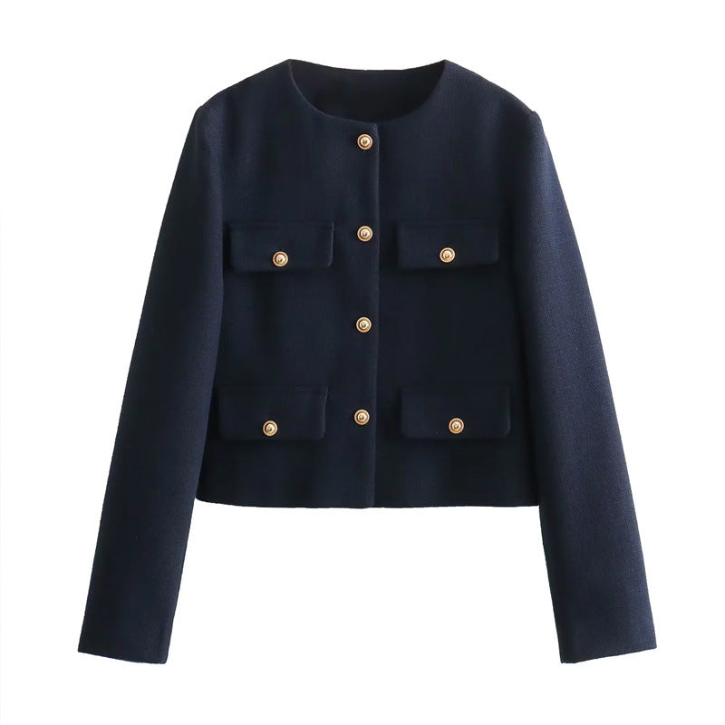 Stylish women's cropped jacket featuring gold buttons. Elegant outerwear, suitable for smart casual occasions.
